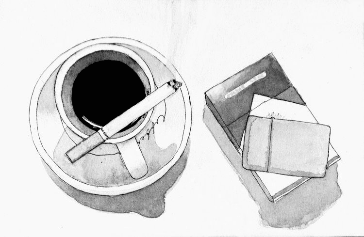 A cup of black coffee with a cigarette resting on the saucer, beside a box of cigarettes and a lighter.